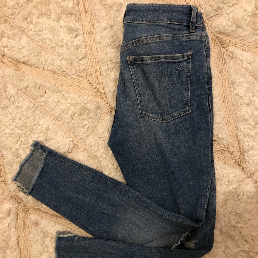 Light denim jeans, distressed hem